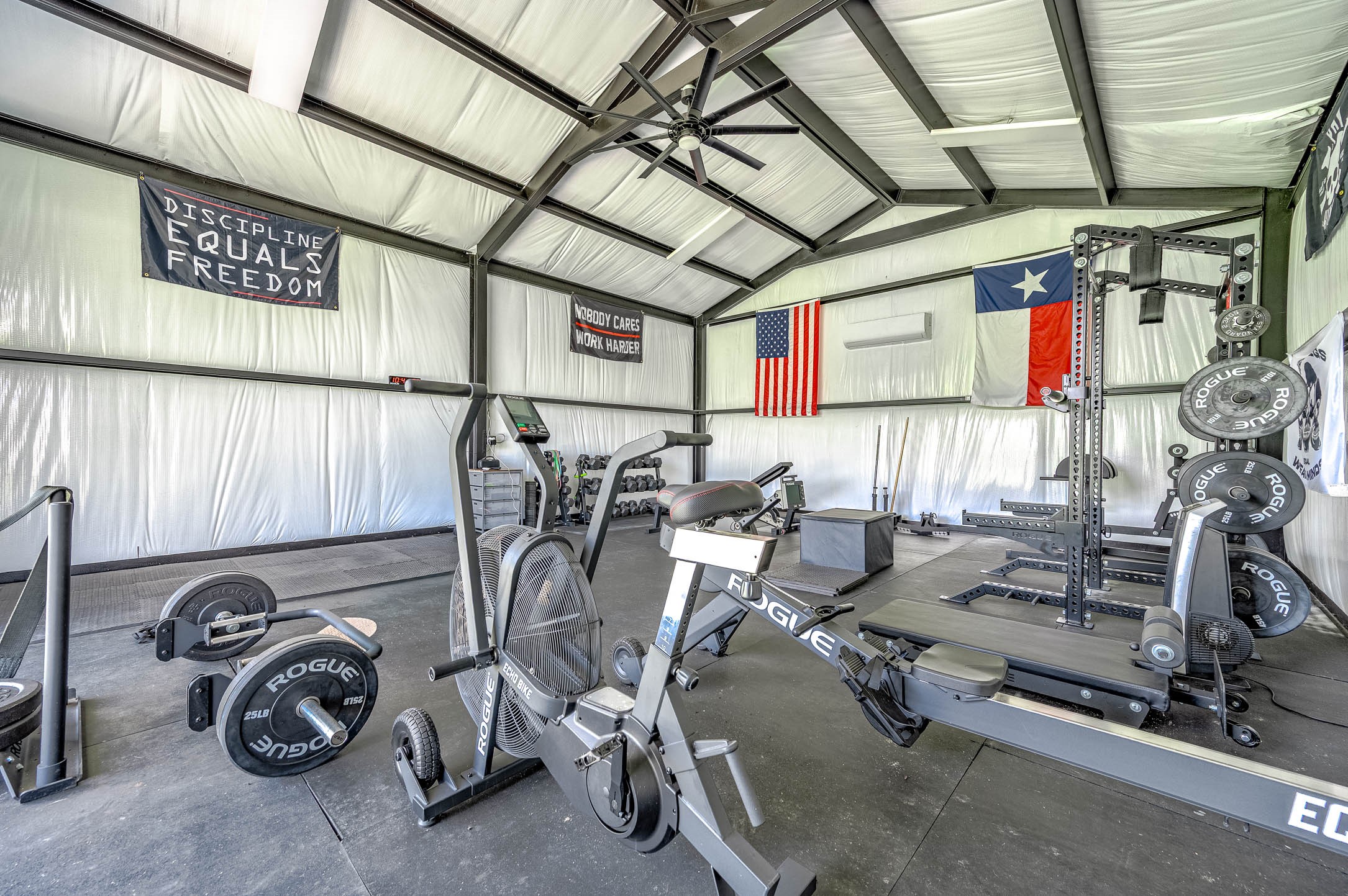 8032 Short Road Needville, TX 77461 - Photo 36 of 50 Another view of the interior gym space showcases the high ceilings, open layout, and room for a wide variety of fitness equipment and activities. The flexible design and generous space make this a unique addition to the property with endless potential uses.