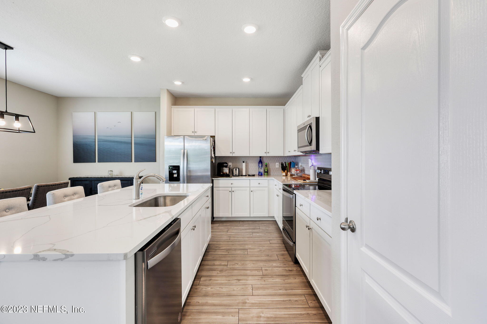 427 Falcon Ridge Road St. Augustine, FL 32084 - Photo 12 of 45 a kitchen with white cabinets sink and white appliances