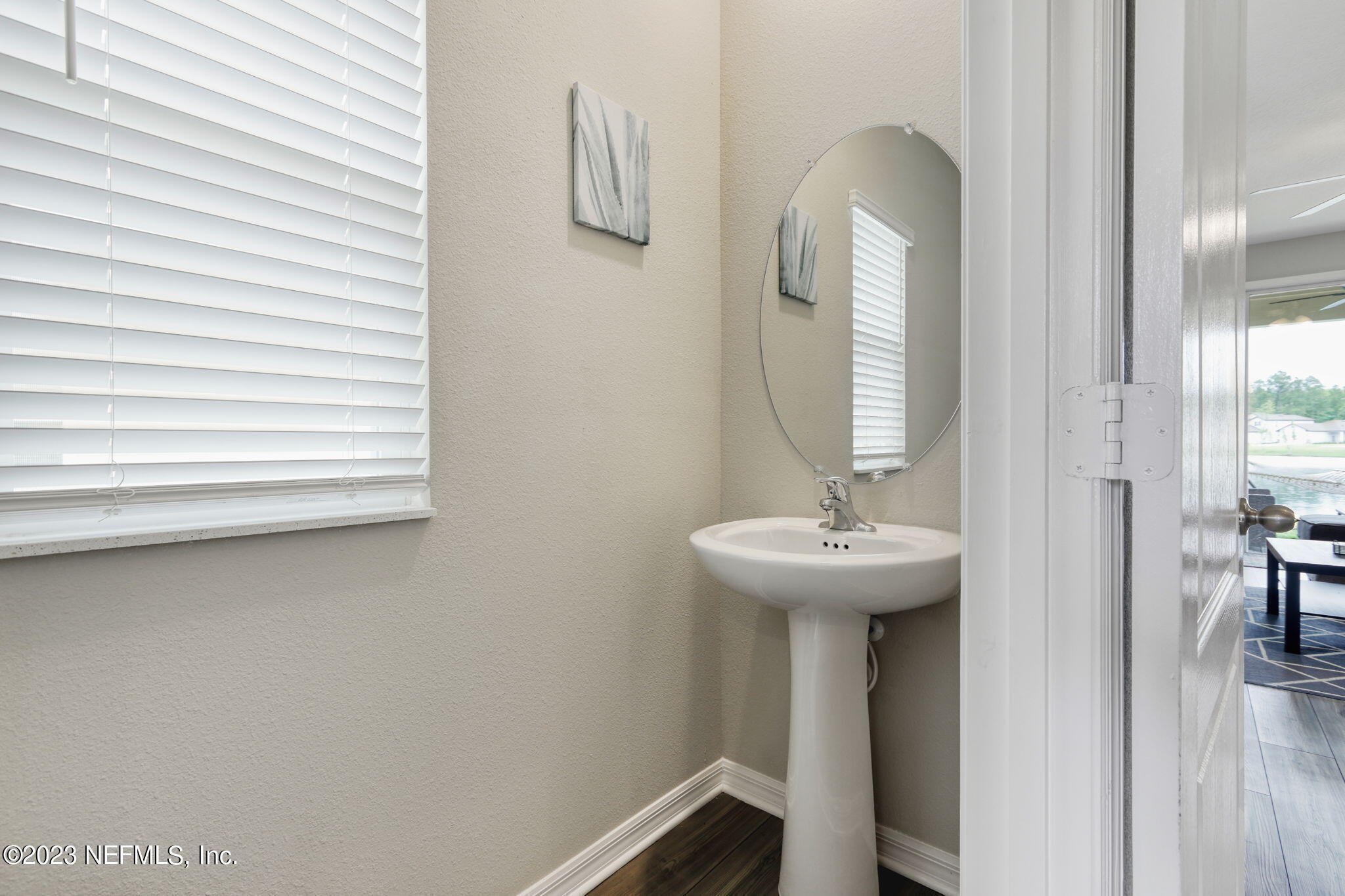427 Falcon Ridge Road St. Augustine, FL 32084 - Photo 14 of 45 a bathroom with a sink and a mirror