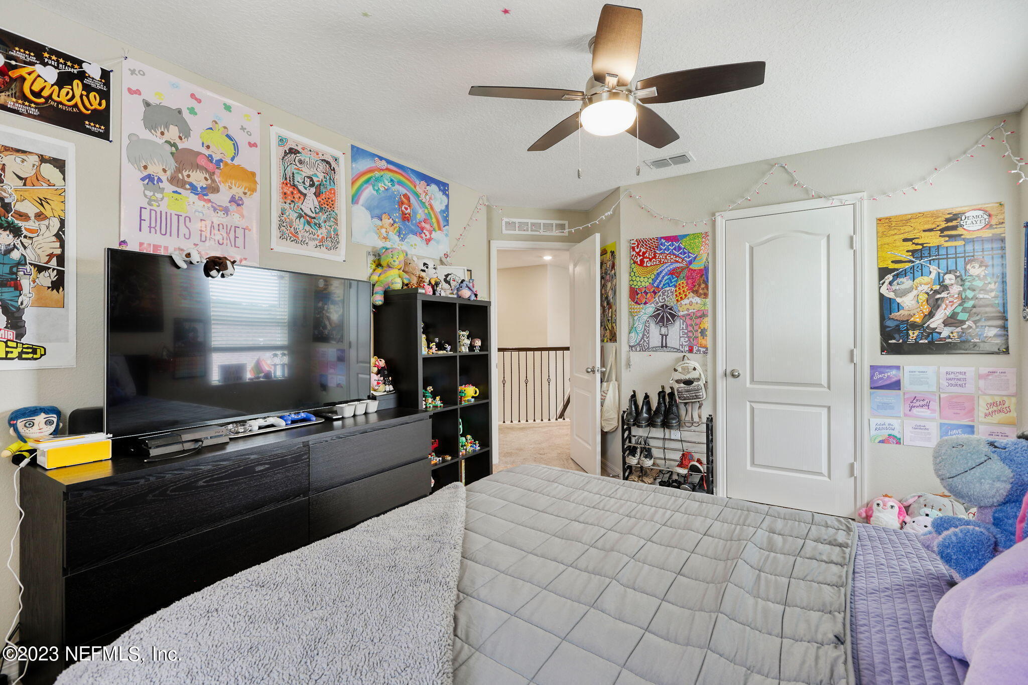 427 Falcon Ridge Road St. Augustine, FL 32084 - Photo 26 of 45 a living room with furniture and a flat screen tv