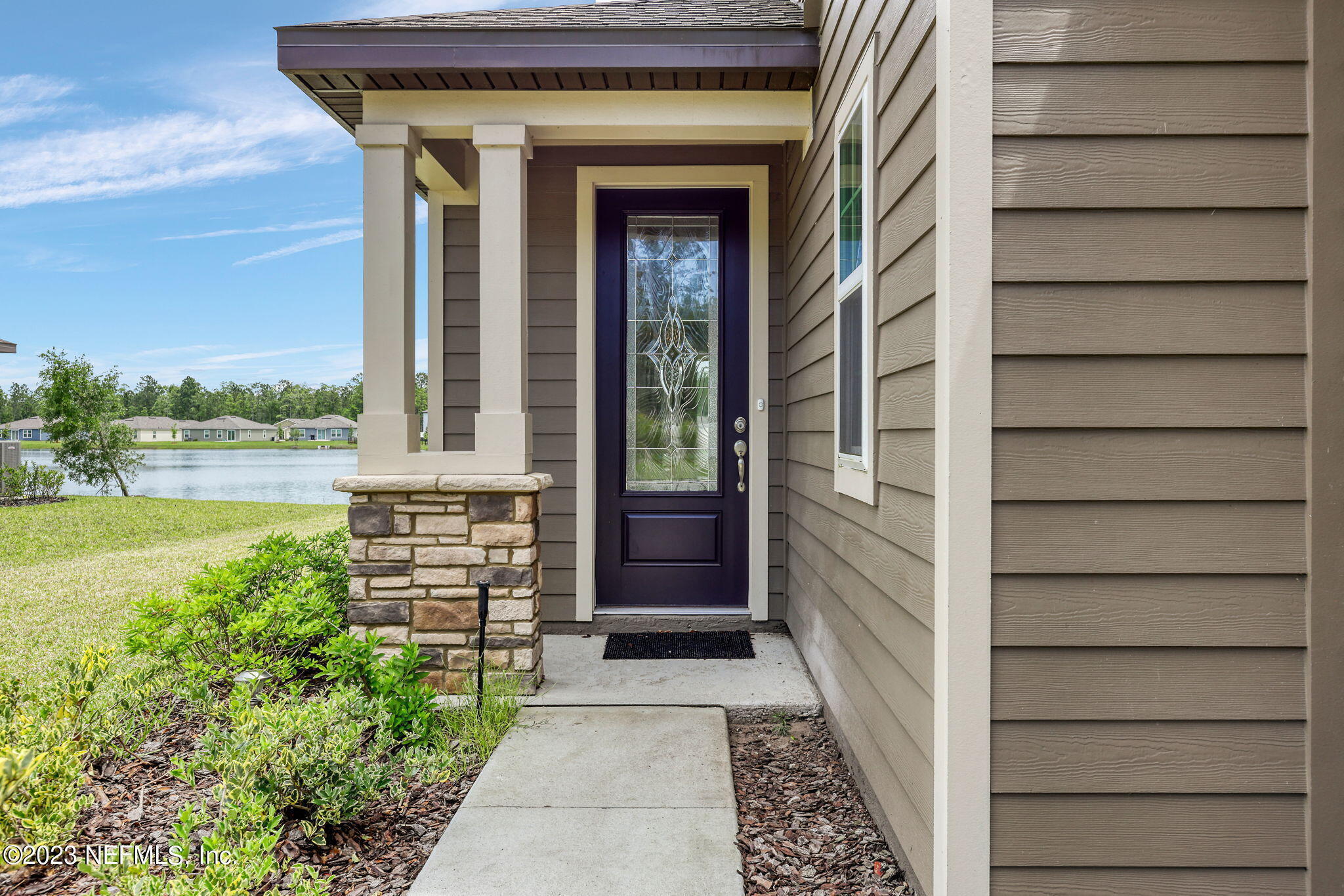 427 Falcon Ridge Road St. Augustine, FL 32084 - Photo 3 of 45 a front view of a house with a yard