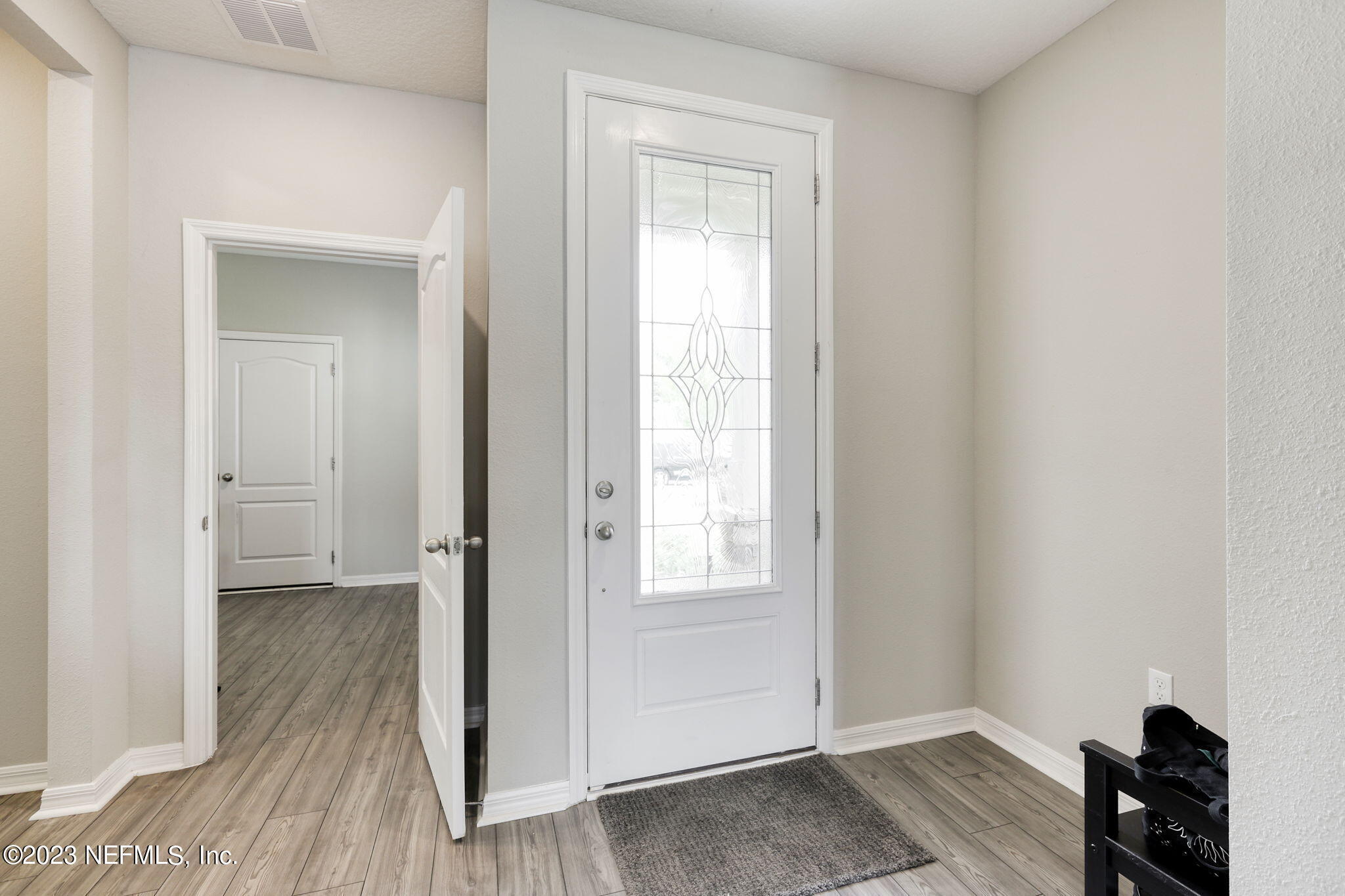 427 Falcon Ridge Road St. Augustine, FL 32084 - Photo 4 of 45 a view of a room with wooden floor closet and windows