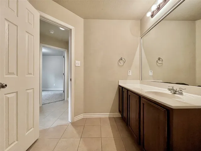 a bathroom with a double vanity sink toilet and shower