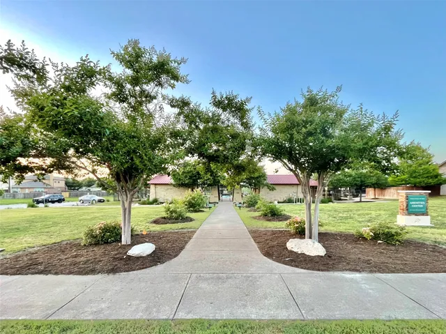 an outdoor view with a garden and trees