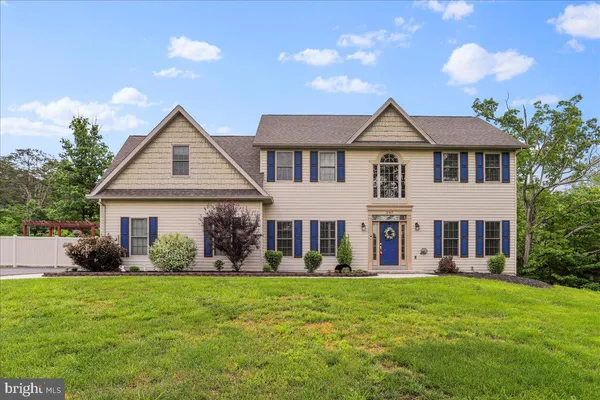 front view of a house with a yard
