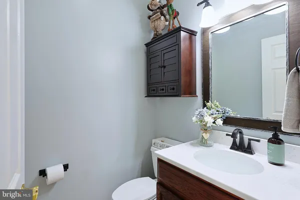 a view of a dining room with furniture wooden floor and chandelier