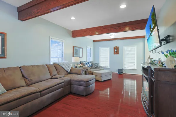 a view of kitchen with furniture and wooden floor