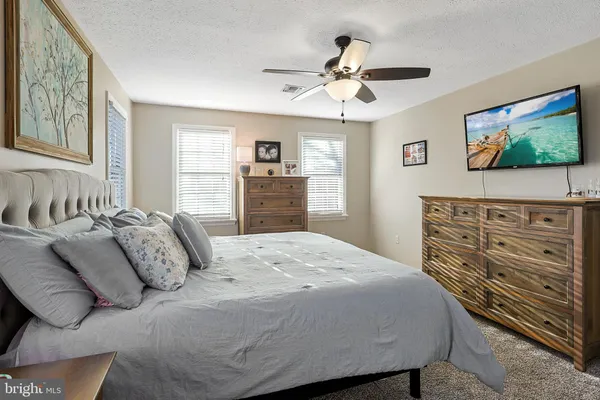 a bathroom with a sink vanity and a mirror