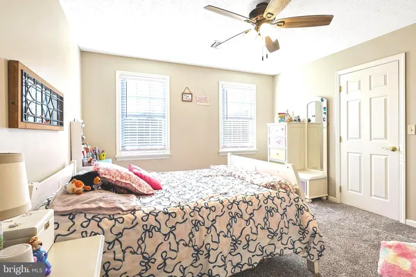 a bathroom with a sink vanity and a mirror