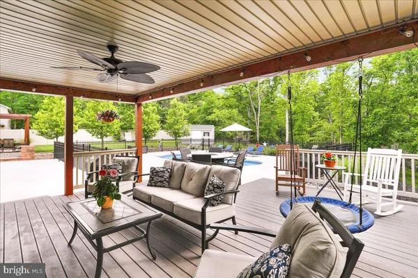 a outdoor living space with patio furniture and garden view