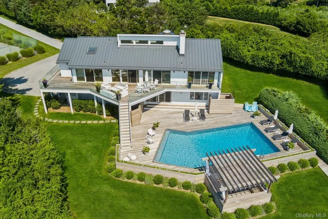 a view of a patio with table and chairs and potted plants