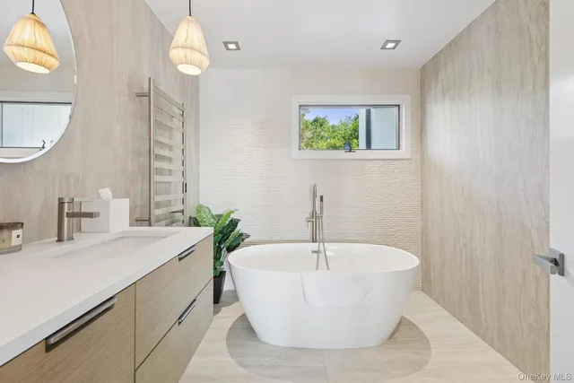 an aerial view of a house with a garden and swimming pool