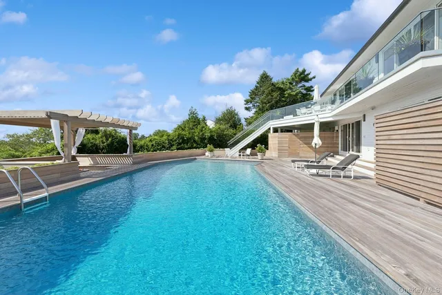 a kitchen with a sink a stove and cabinets