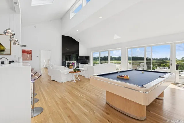a kitchen with sink and white cabinets