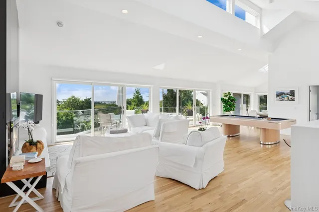a view of a patio with table and chairs and potted plants