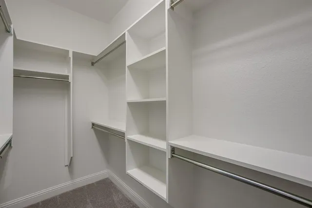 a bathroom with a sink toilet vanity and shower