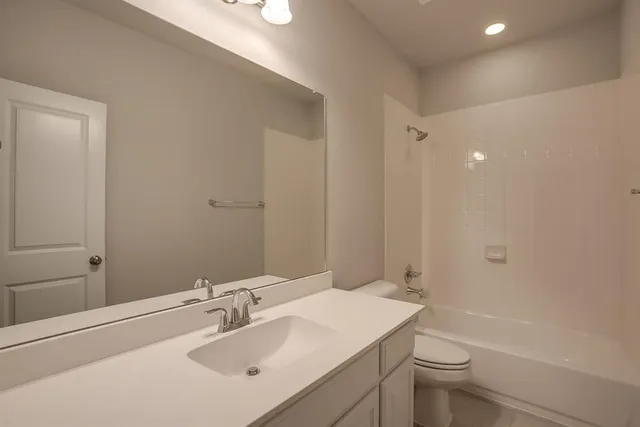 a view of an house with backyard and balcony