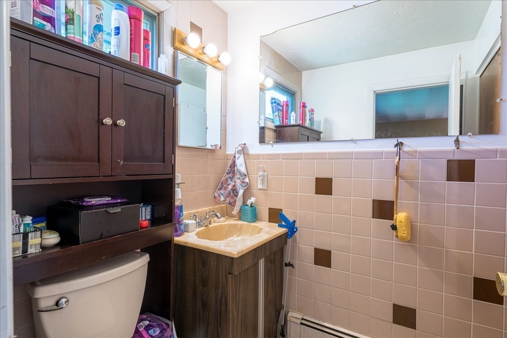 59 Eaton Road Framingham, MA 01701 - Photo 16 of 21 a bathroom with a sink a toilet and a mirror