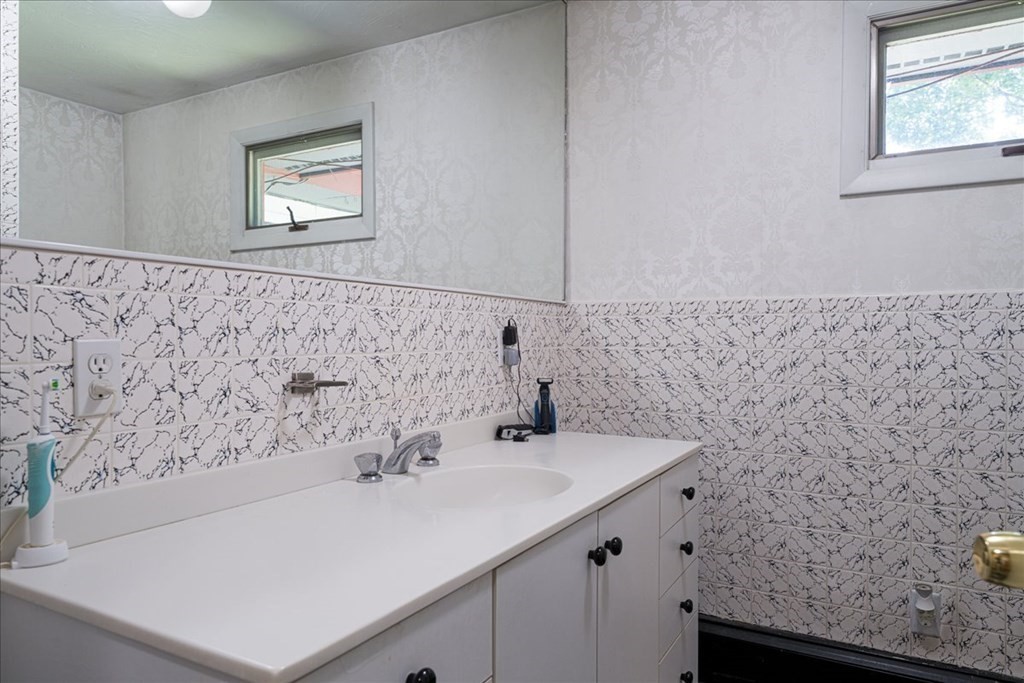 59 Eaton Road Framingham, MA 01701 - Photo 17 of 21 a bathroom with a sink and a mirror