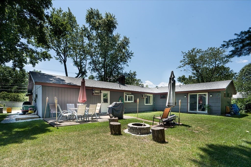 59 Eaton Road Framingham, MA 01701 - Photo 18 of 21 a front view of a house with garden and sitting area