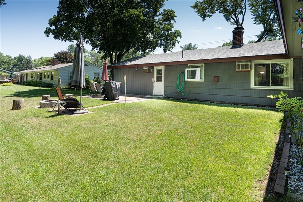 59 Eaton Road Framingham, MA 01701 - Photo 21 of 21 a view of a house with backyard and sitting area