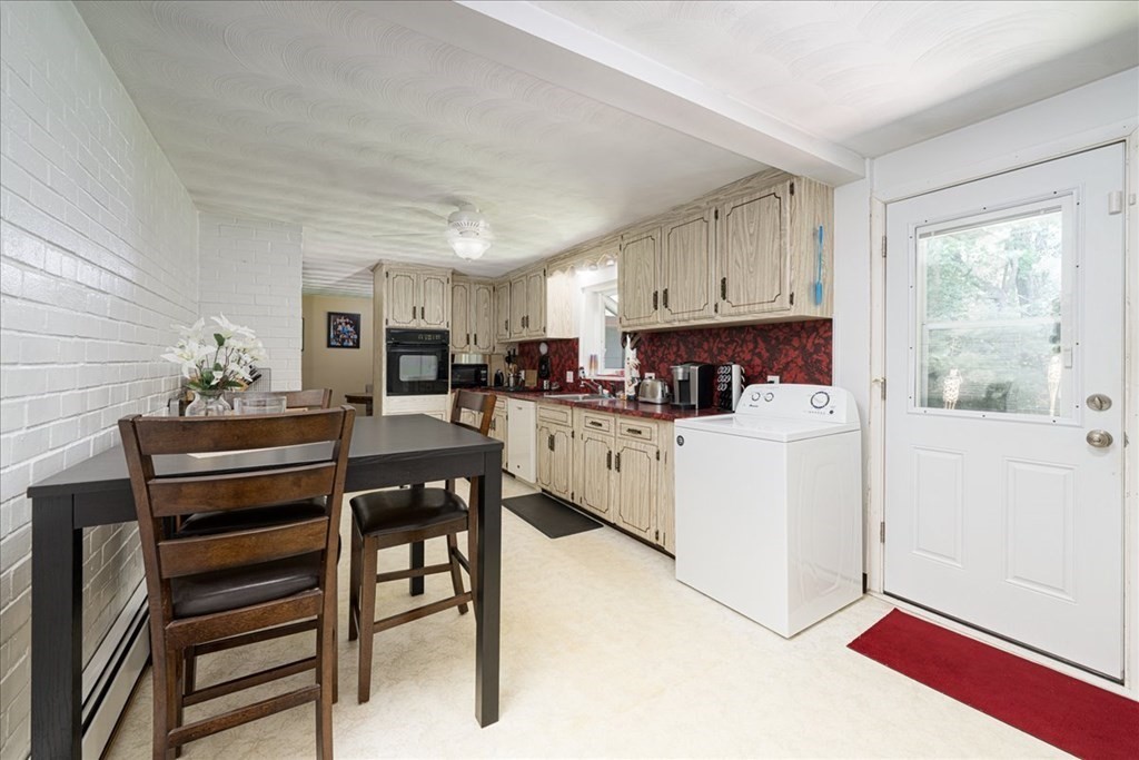 59 Eaton Road Framingham, MA 01701 - Photo 5 of 21 a kitchen with cabinets a sink and appliances