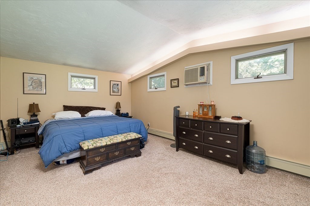 59 Eaton Road Framingham, MA 01701 - Photo 7 of 21 a spacious bedroom with a bed and a night stand