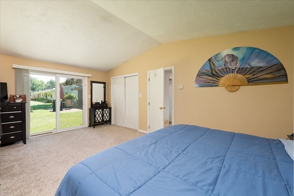 59 Eaton Road Framingham, MA 01701 - Photo 8 of 21 a bedroom with a bed and a painting on the wall