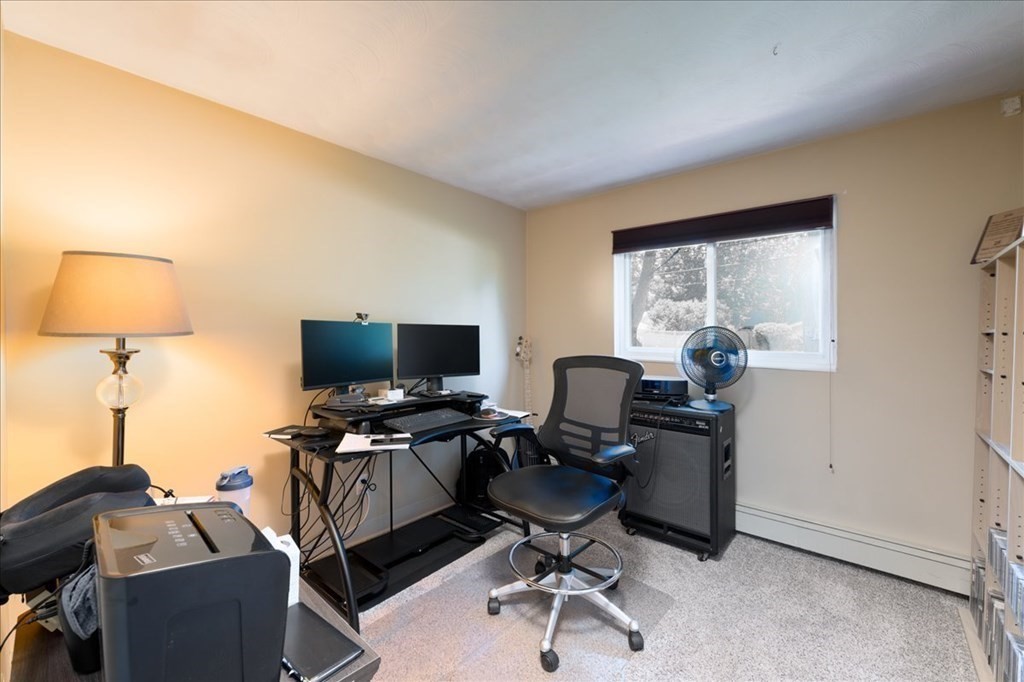 59 Eaton Road Framingham, MA 01701 - Photo 9 of 21 a view of a workspace with furniture and a window