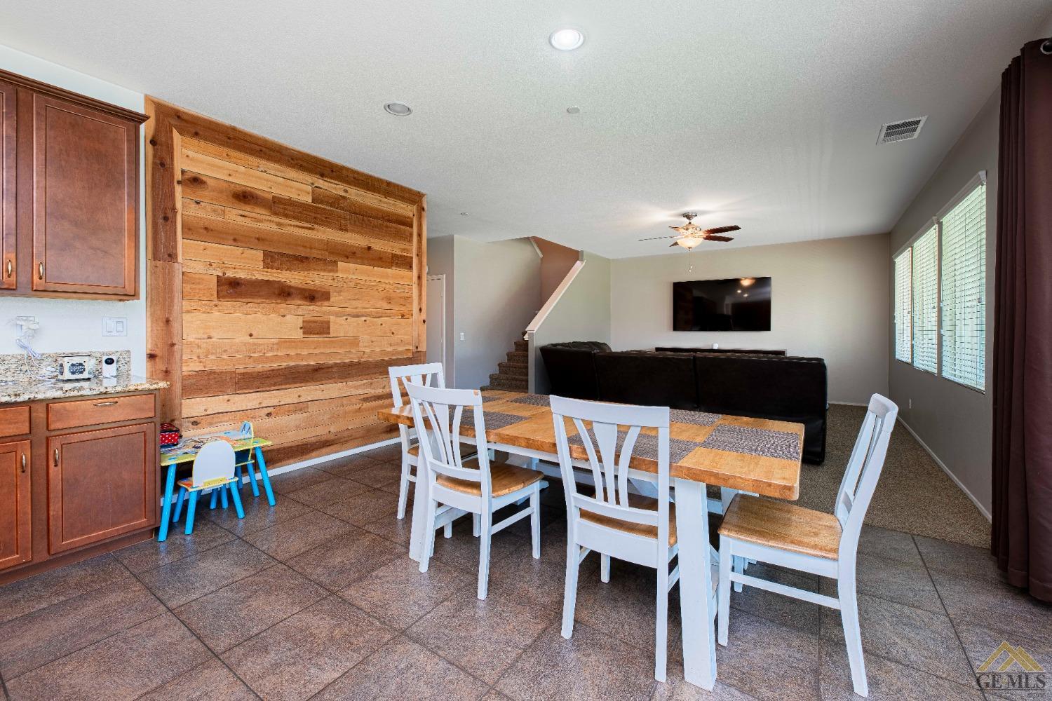 Undisclosed Address Bakersfield, CA 93314 - Photo 11 of 49 a dining room with furniture and natural light