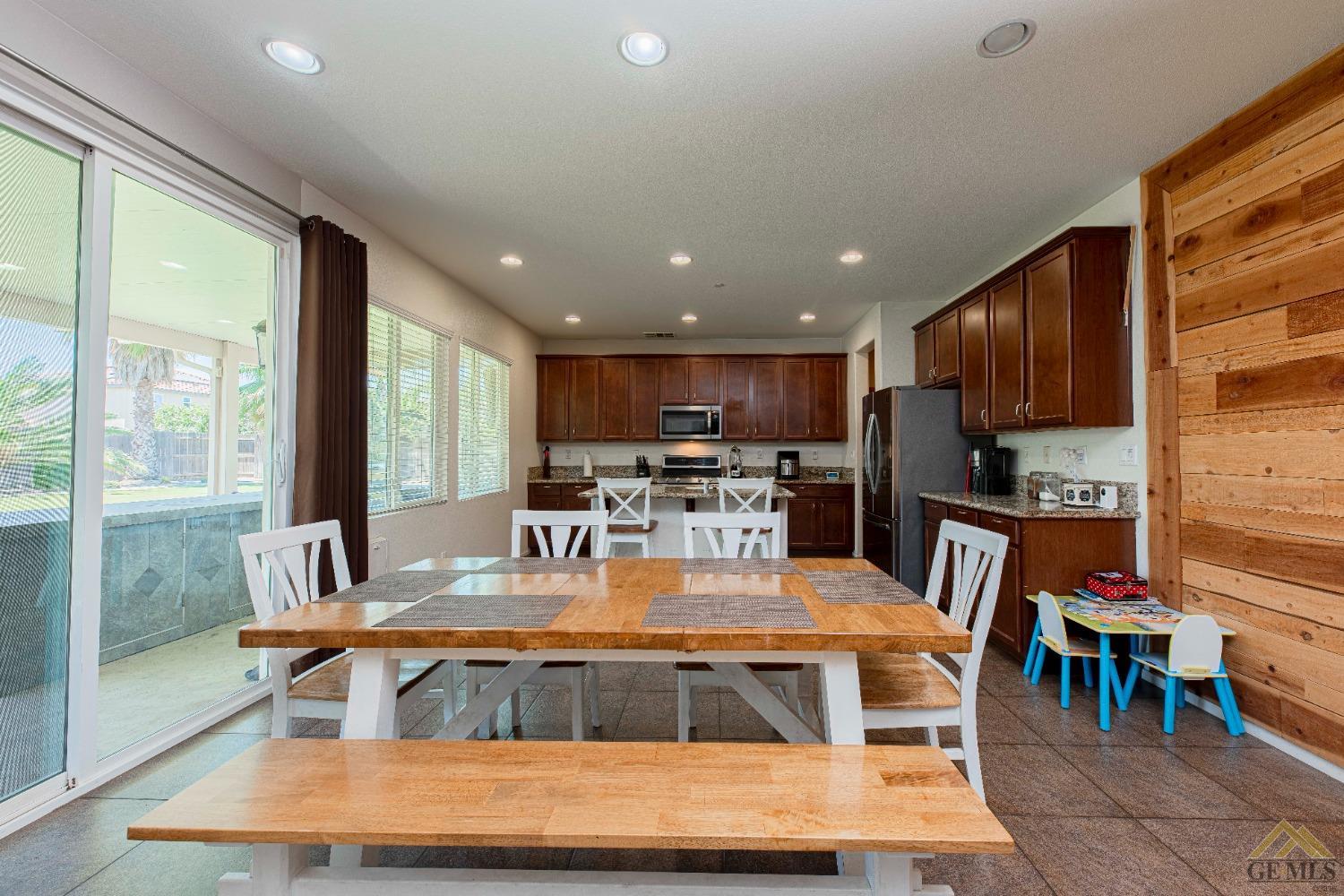 Undisclosed Address Bakersfield, CA 93314 - Photo 13 of 49 a view of a dining room with furniture window and outside view