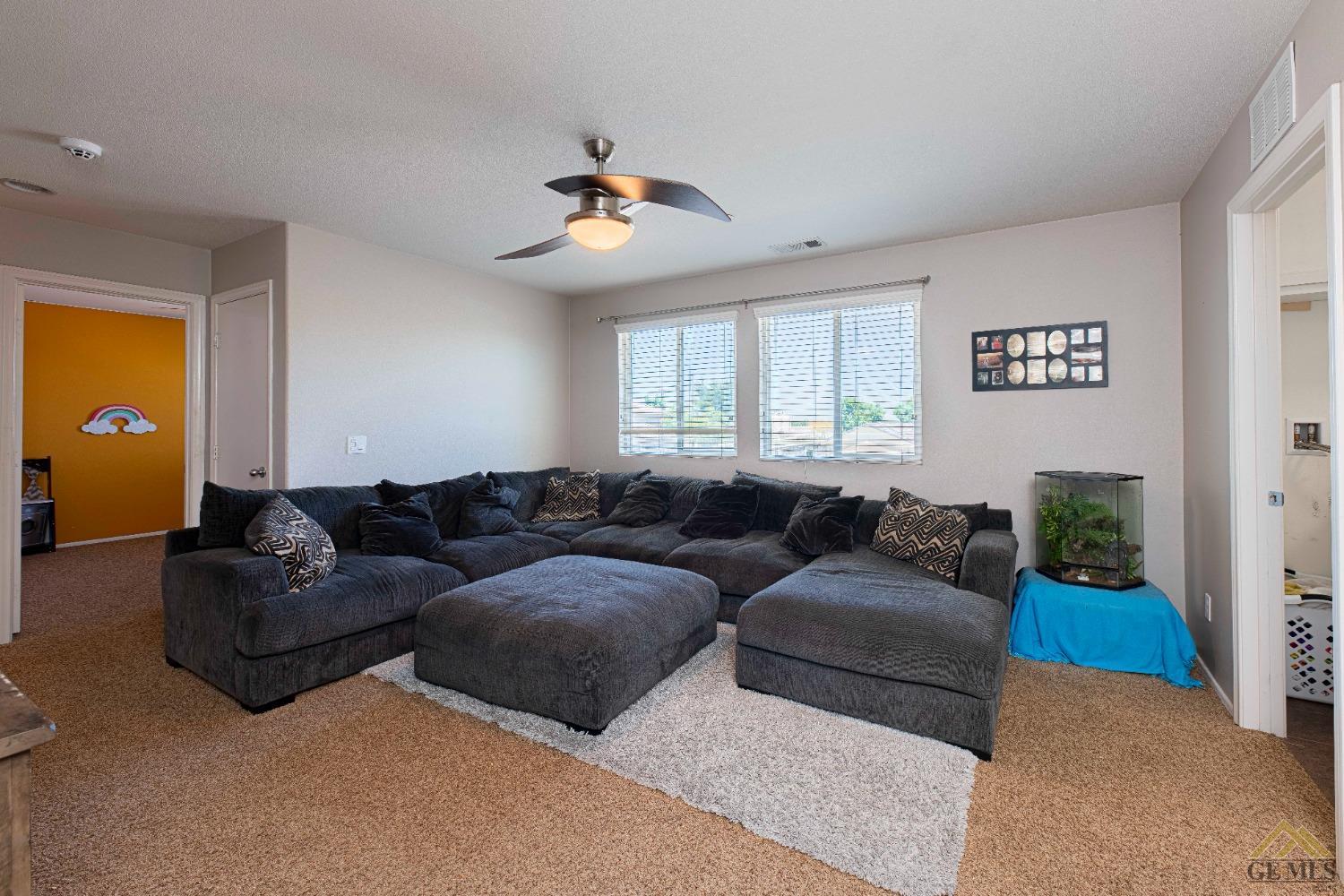 Undisclosed Address Bakersfield, CA 93314 - Photo 23 of 49 a living room with furniture and a large window