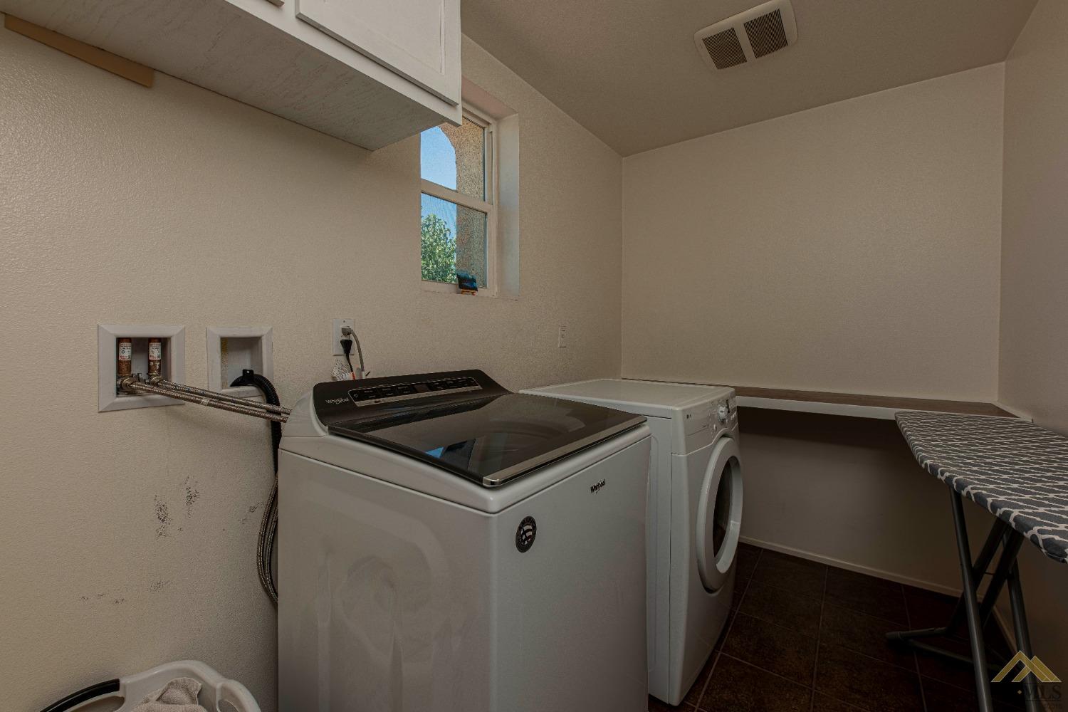 Undisclosed Address Bakersfield, CA 93314 - Photo 25 of 49 a utility room with dryer and washer