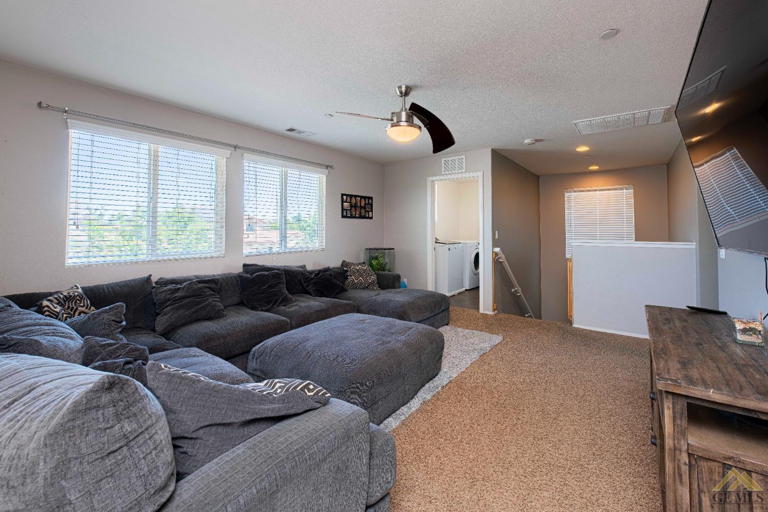 Undisclosed Address Bakersfield, CA 93314 - Photo 26 of 49 a living room with furniture and a window