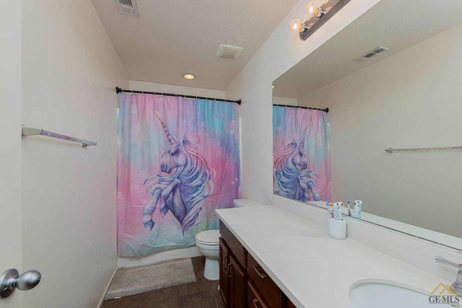 Undisclosed Address Bakersfield, CA 93314 - Photo 29 of 49 a bathroom with a sink and a mirror