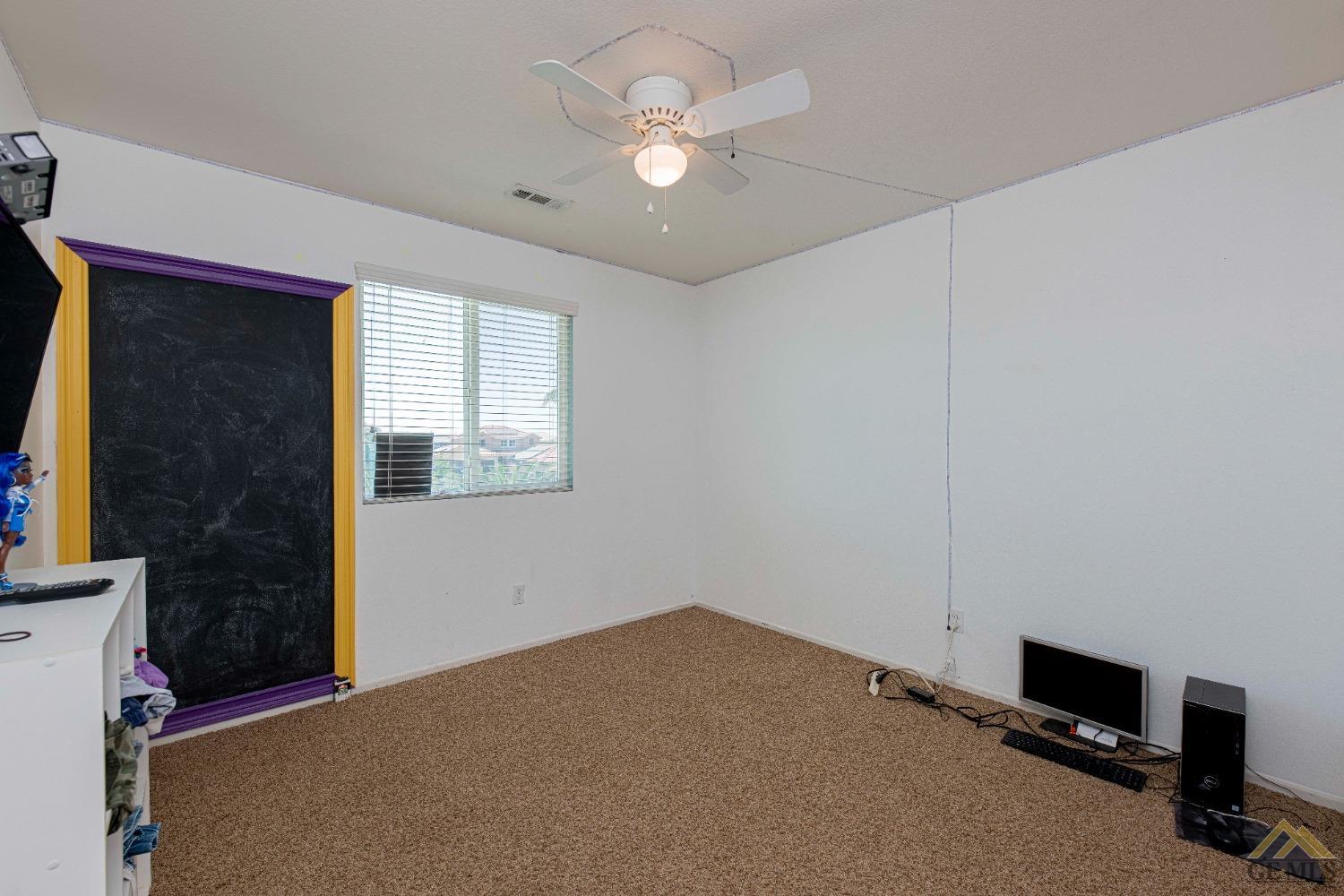 Undisclosed Address Bakersfield, CA 93314 - Photo 30 of 49 a view of a livingroom with a workspace