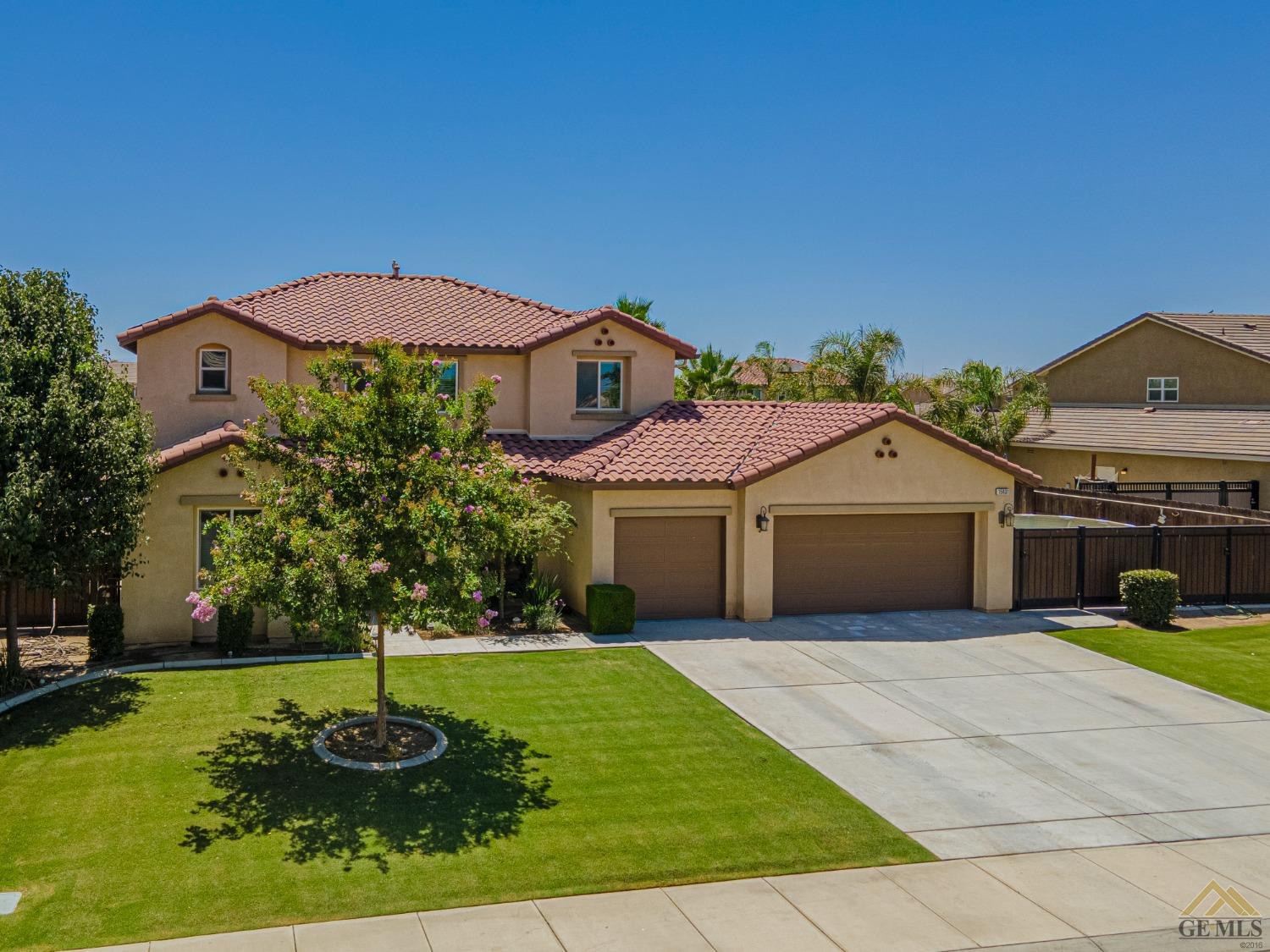 Undisclosed Address Bakersfield, CA 93314 - Photo 3 of 49 a front view of a house with a yard