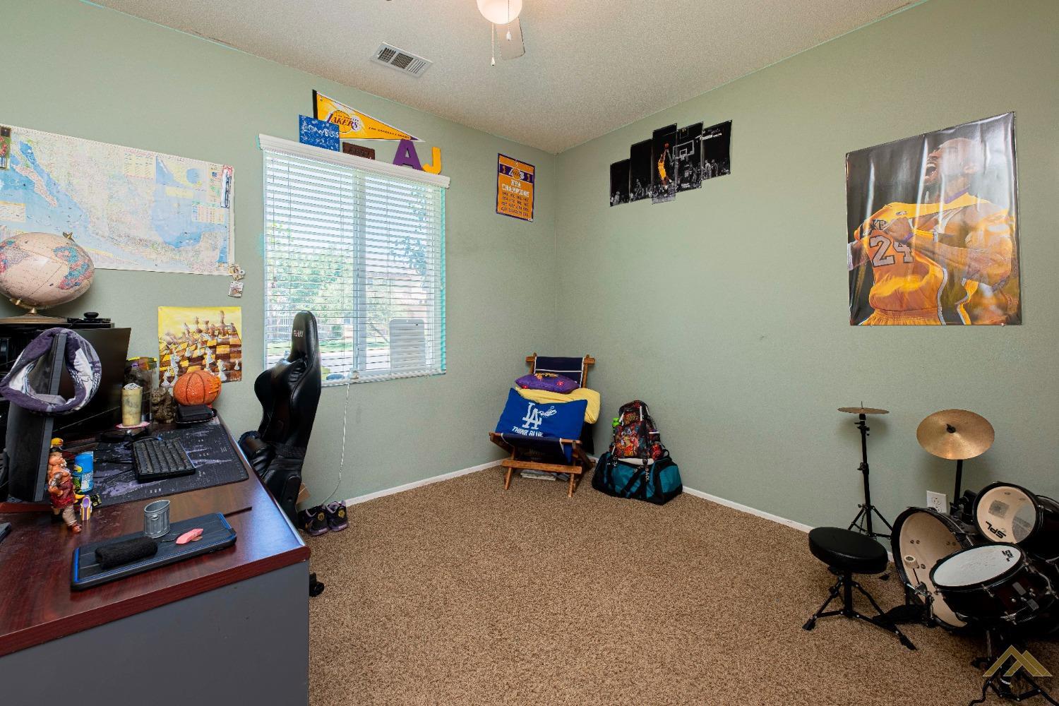 Undisclosed Address Bakersfield, CA 93314 - Photo 32 of 49 a room with furniture and a window