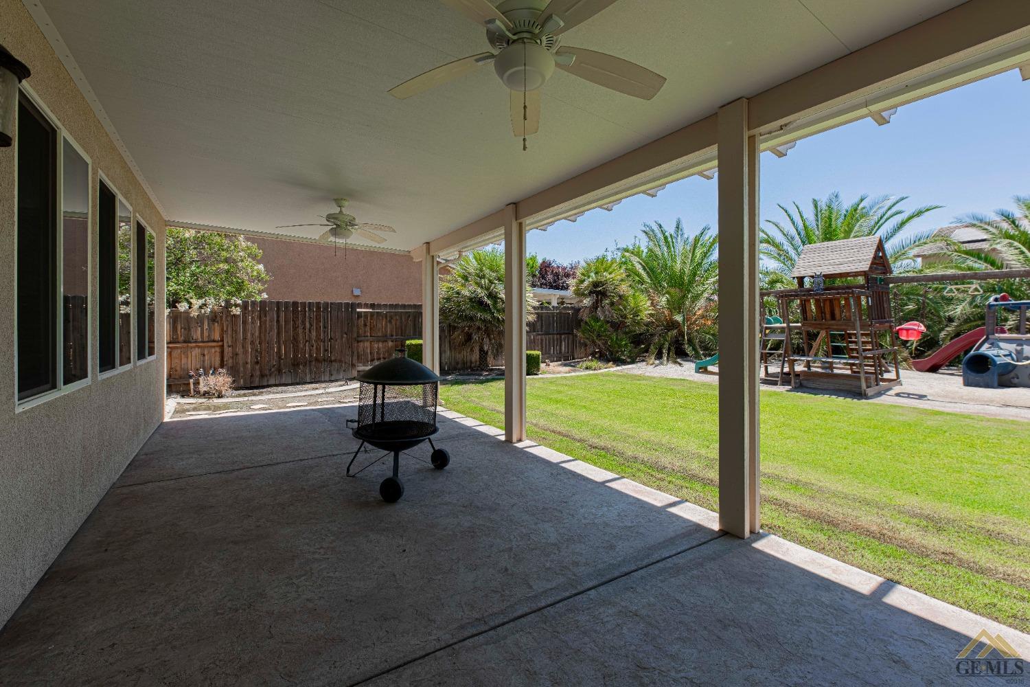 Undisclosed Address Bakersfield, CA 93314 - Photo 41 of 49 a swimming pool with outdoor seating yard and glass windows