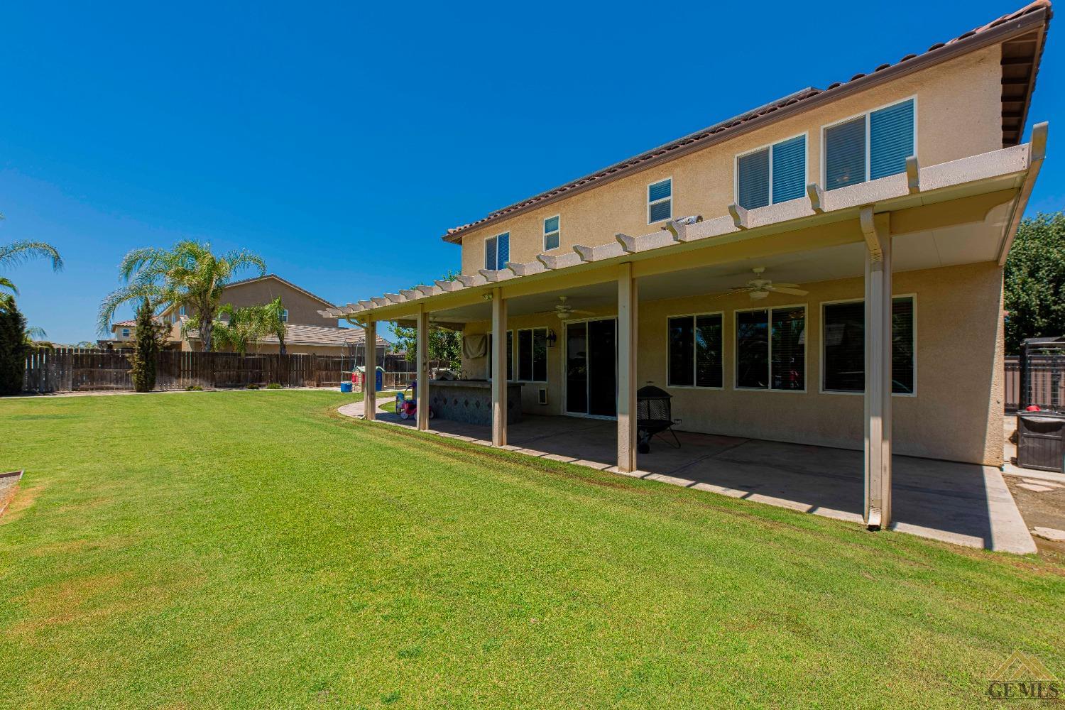 Undisclosed Address Bakersfield, CA 93314 - Photo 45 of 49 a view of house with backyard and garden