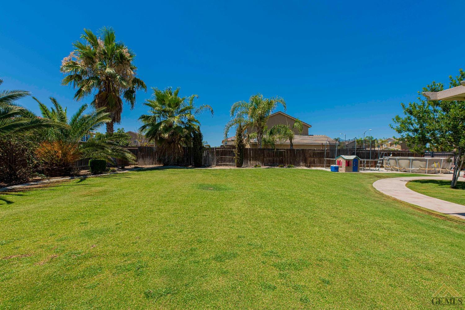 Undisclosed Address Bakersfield, CA 93314 - Photo 46 of 49 a view of yard with swimming pool and green space