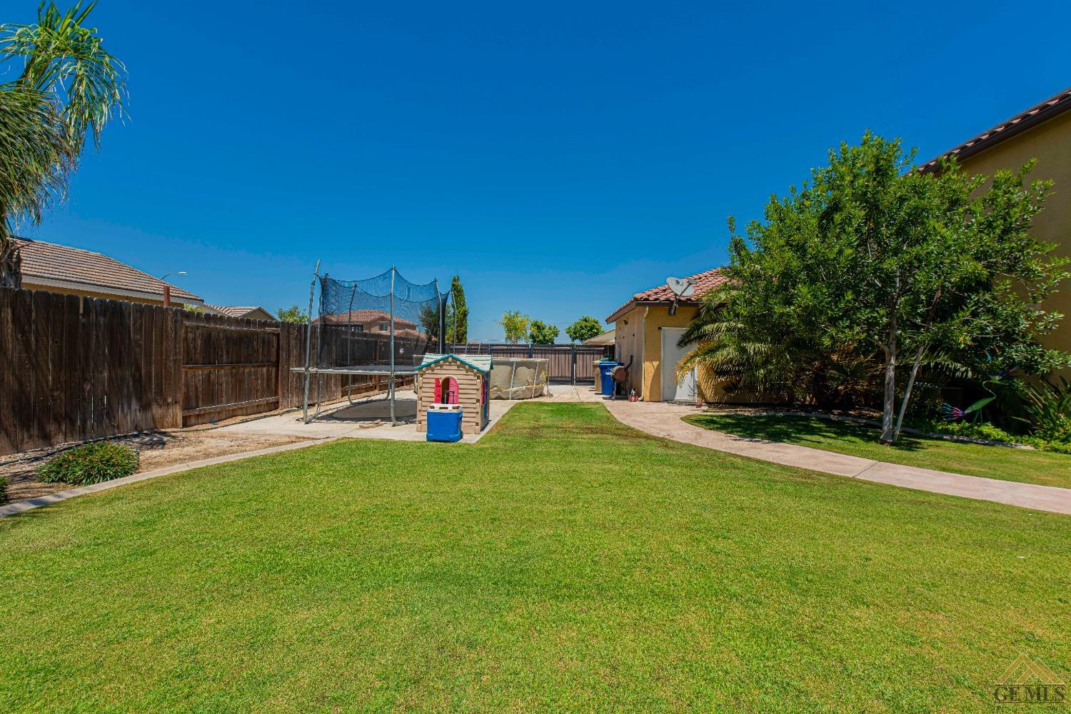 Undisclosed Address Bakersfield, CA 93314 - Photo 48 of 49 a view of a garden and basketball court