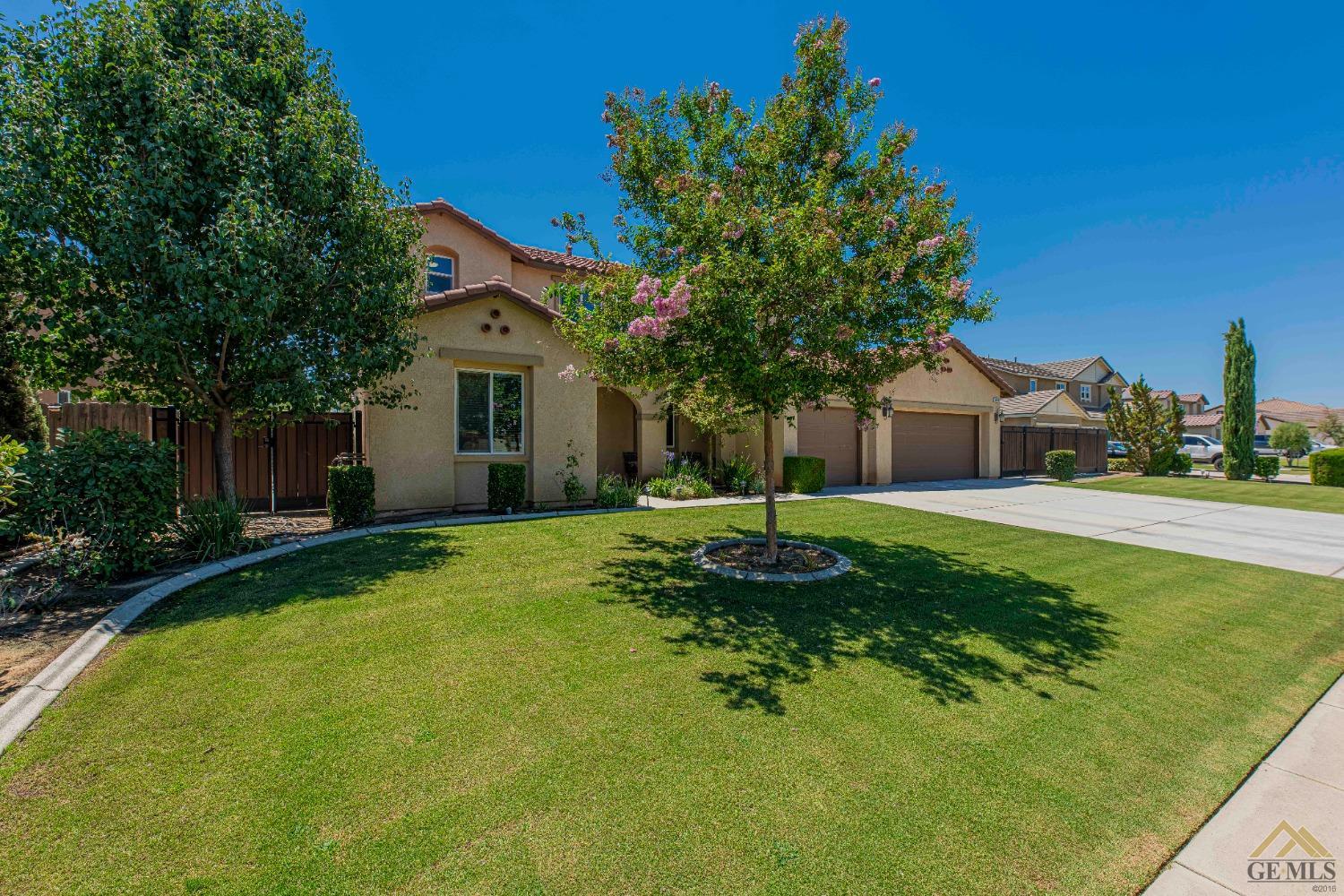 Undisclosed Address Bakersfield, CA 93314 - Photo 5 of 49 a front view of a house with a yard