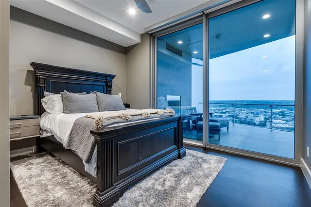 a bed room with a bed and balcony