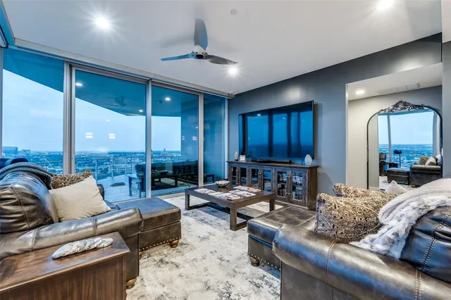 a living room with furniture and a large window