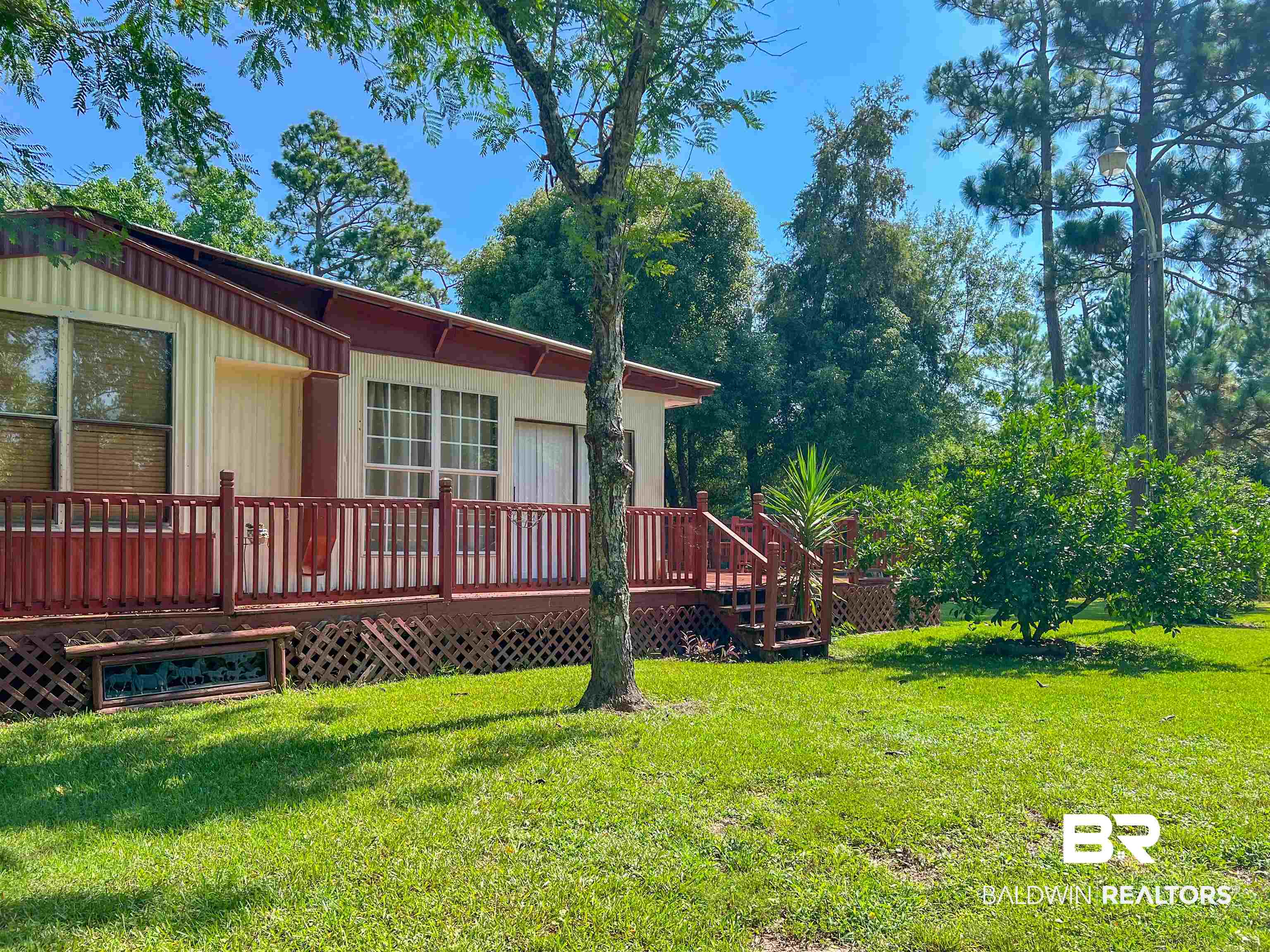 9190 County Road 97 Elberta, AL 36530 - Photo 2 of 53 View of yard with a deck