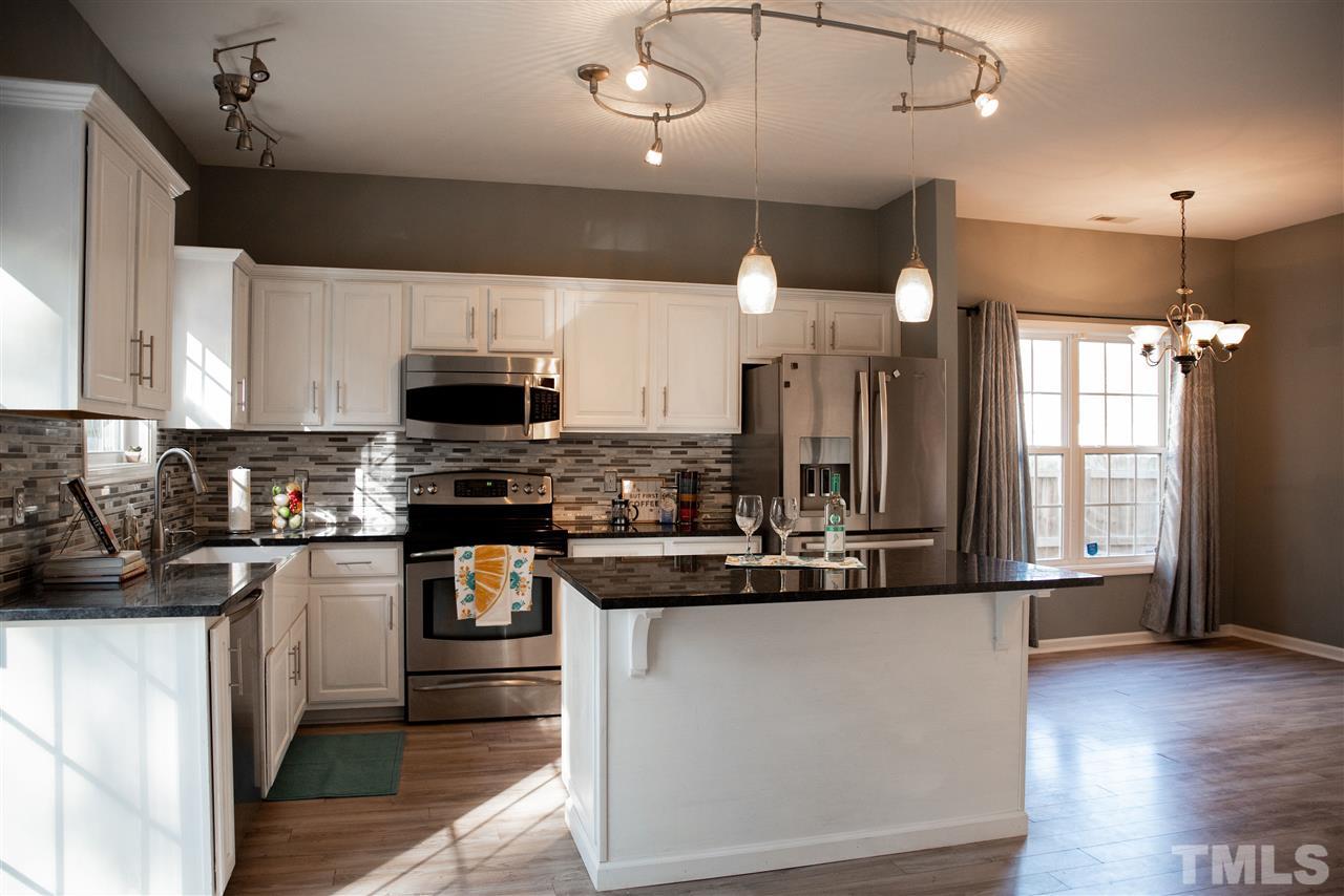 5848 Forest Point Road Raleigh, NC 27610 - Photo 4 of 21 Pull up a stool and grab your friends -- plenty of space on this oversized island.