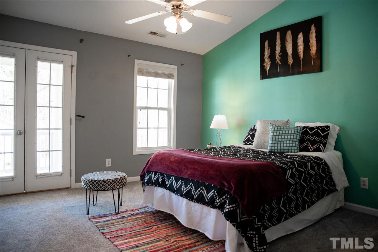 5848 Forest Point Road Raleigh, NC 27610 - Photo 7 of 21 Enjoy sweet dreams in this dreamy suite with access to your own private balcony.