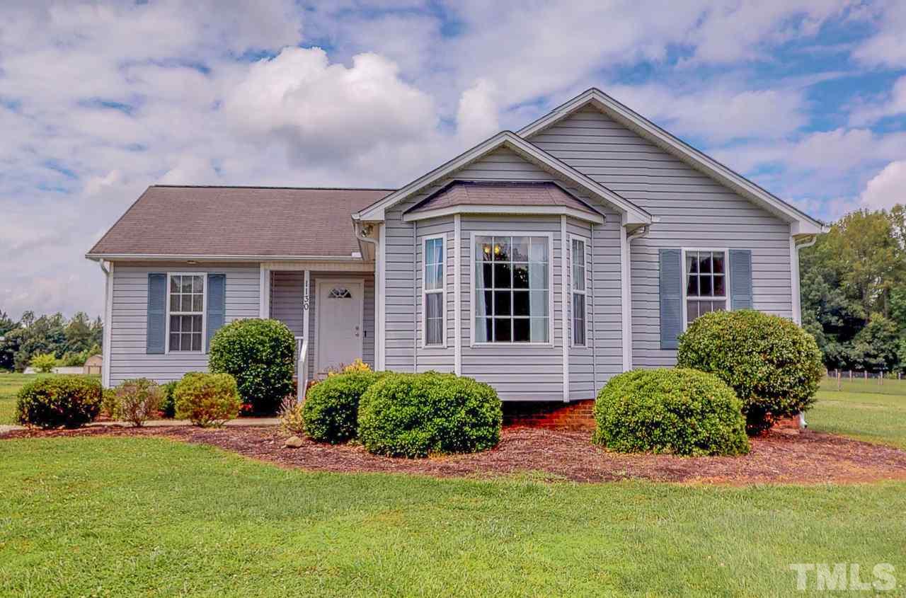 1130 Willie Gray Road Timberlake, NC 27583 - Photo 1 of 27 a front view of a house with a yard