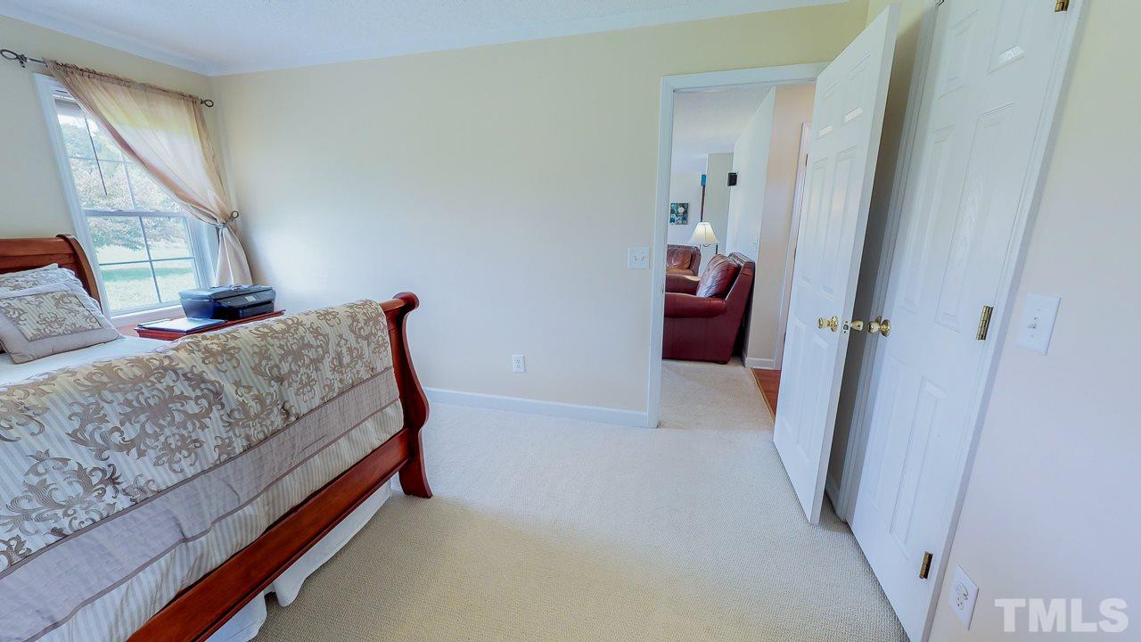 1130 Willie Gray Road Timberlake, NC 27583 - Photo 14 of 27 a bedroom with a bed and a window